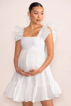 Dolly Daze | White Maternity Ruffle Sleeve Babydoll Mini Dress 10 Dolly Daze | White Maternity Ruffle Sleeve Babydoll Mini Dress -ENY Clothing Shop WB CL126466 DollyDazeWhiteRuffleSleeveBabydollMaternityMiniDress1