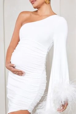 With A Flourish | White Asymmetric One-Sleeved Maternity Maxi Dress With Feathers -ENY Clothing Shop WB CL129592005 WithAFlourishWhiteAsymmetricOne SleevedMaternityMaxiDressWithFeathers4