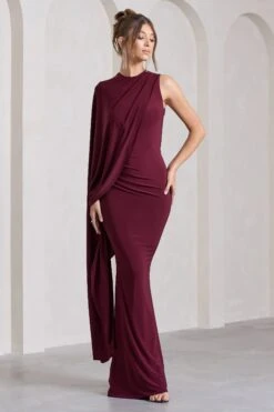 Unveil | Burgundy One-Sleeve Cape Maxi Dress 10 Unveil | Burgundy One-Sleeve Cape Maxi Dress -ENY Clothing Shop WB CL129803069 UnveilBurgundyOne SleeveCapeMaxiDress5
