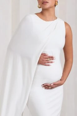 Unveil | White One-Sleeve Cape Maternity Maxi Dress -ENY Clothing Shop WB CL129835005 UnveilWhiteOne SleeveCapeMaternityMaxiDress5
